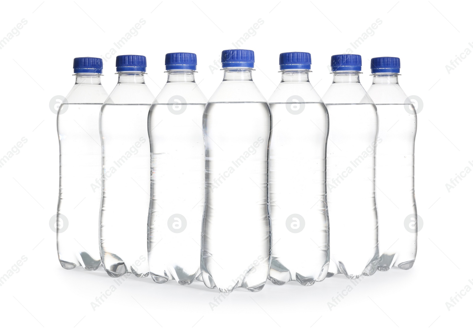 Photo of Plastic bottles with pure water on white background