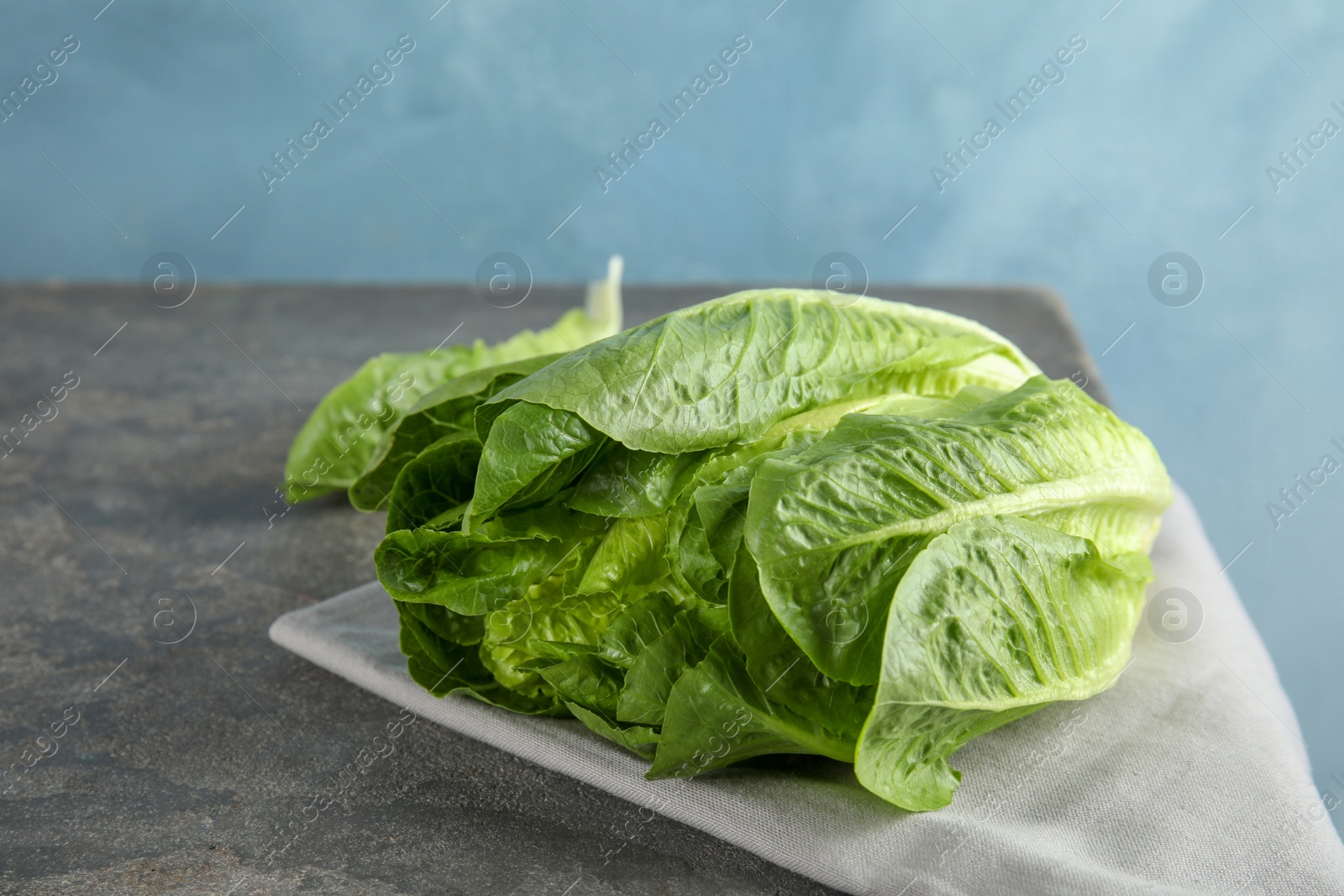 Photo of Fresh ripe cos lettuce on table