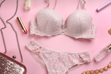 Photo of Flat lay composition with sexy women's underwear on pink background