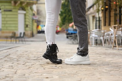 Photo of Lovely couple enjoying time together outdoors, closeup. Romantic date