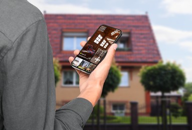 Man using smart home security system on mobile phone near house outdoors, closeup. Device showing different rooms through cameras