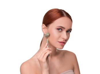 Photo of Young woman massaging her face with jade roller on white background