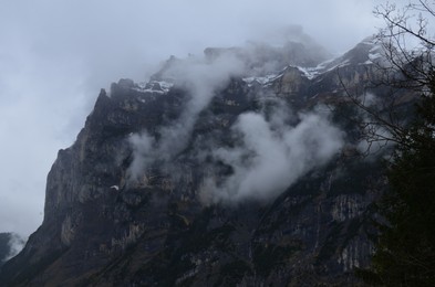 Picturesque view of mountains covered with fog