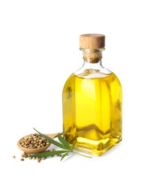 Photo of Bottle with hemp oil, leaf and seeds on white background