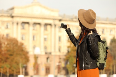 Photo of Traveler with photo camera on city street
