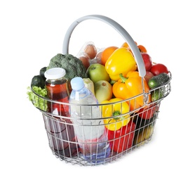 Shopping basket with grocery products on white background