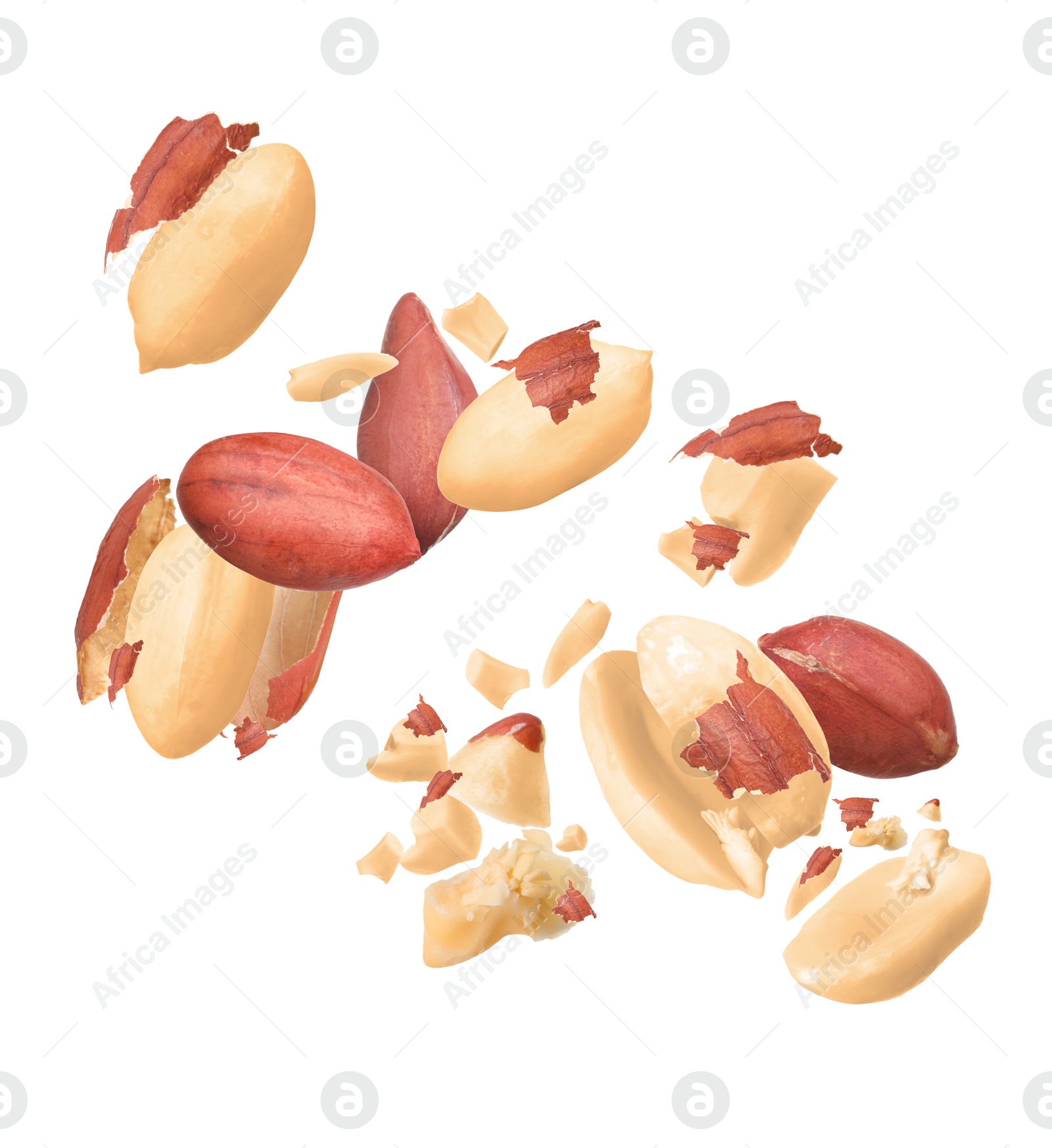 Image of Many peanuts in air on white background