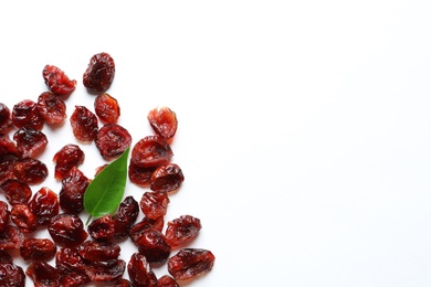 Cranberries on white background, top view with space for text. Dried fruit as healthy snack