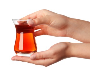 Photo of Woman holding glass of traditional Turkish tea on white background, closeup