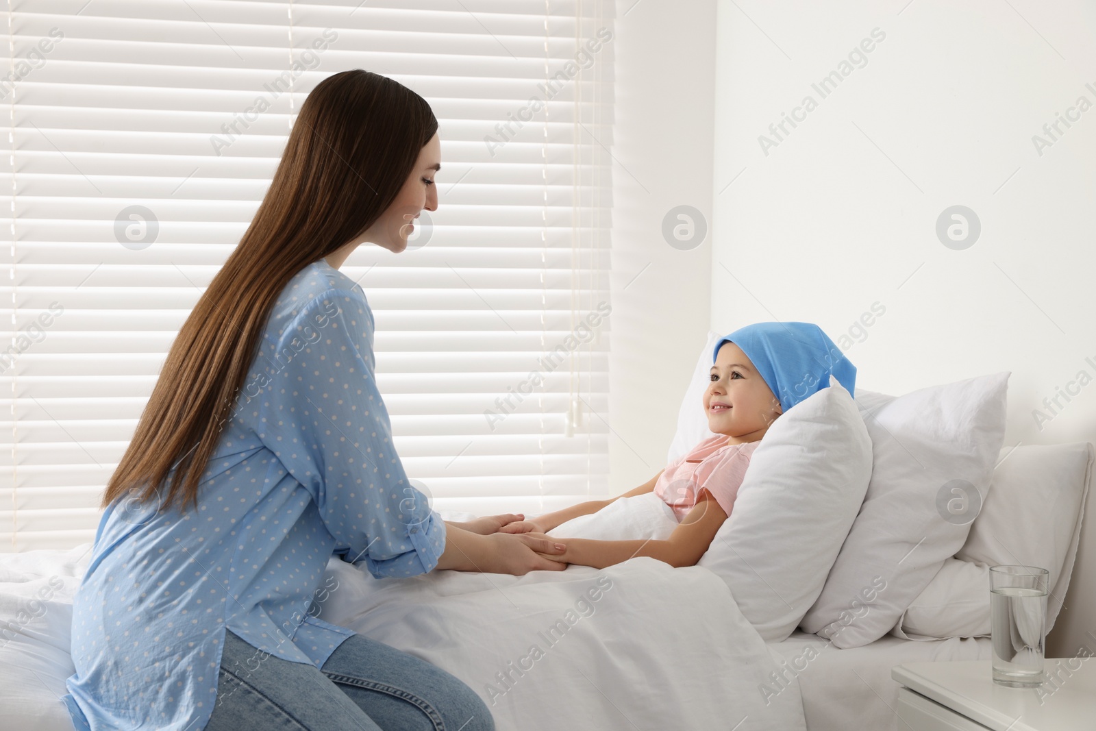 Photo of Childhood cancer. Mother and daughter in hospital