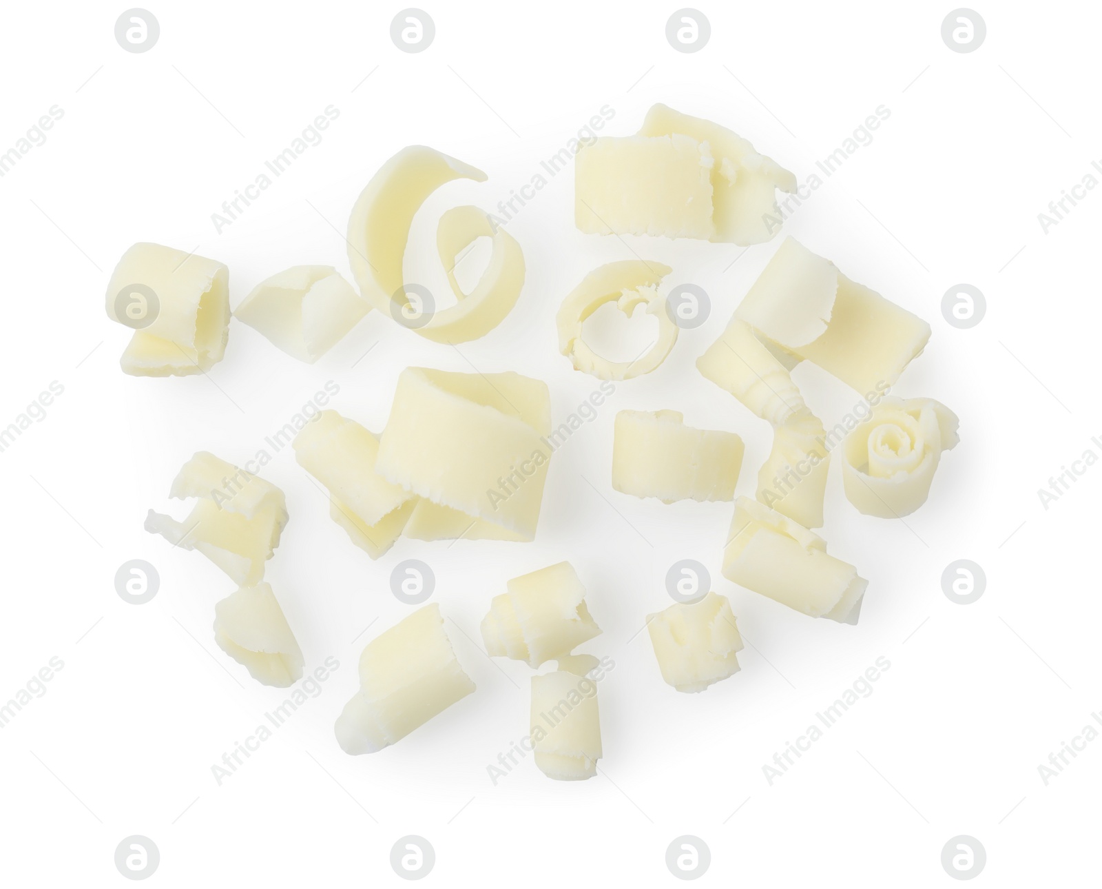 Photo of Many tasty chocolate shavings isolated on white, top view