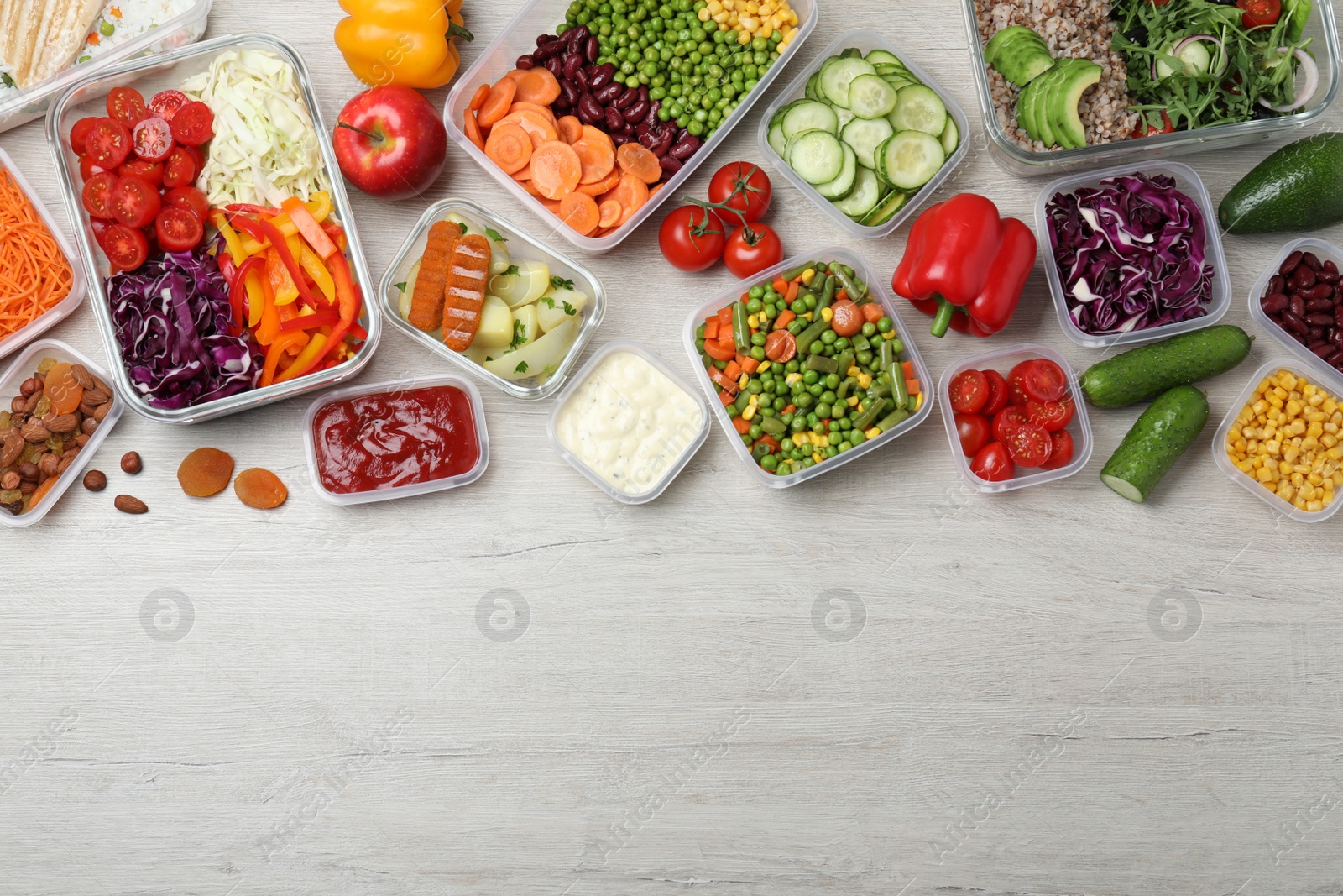 Photo of Set of containers with fresh food on white wooden table, flat lay. Space for text