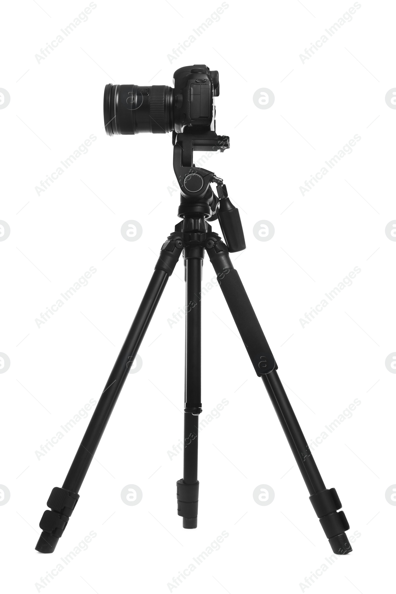 Photo of Modern tripod with professional camera isolated on white