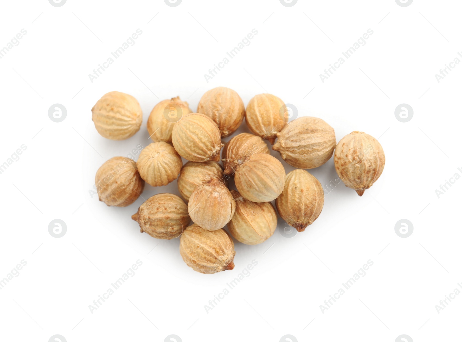 Photo of Heap of dried coriander seeds on white background, top view