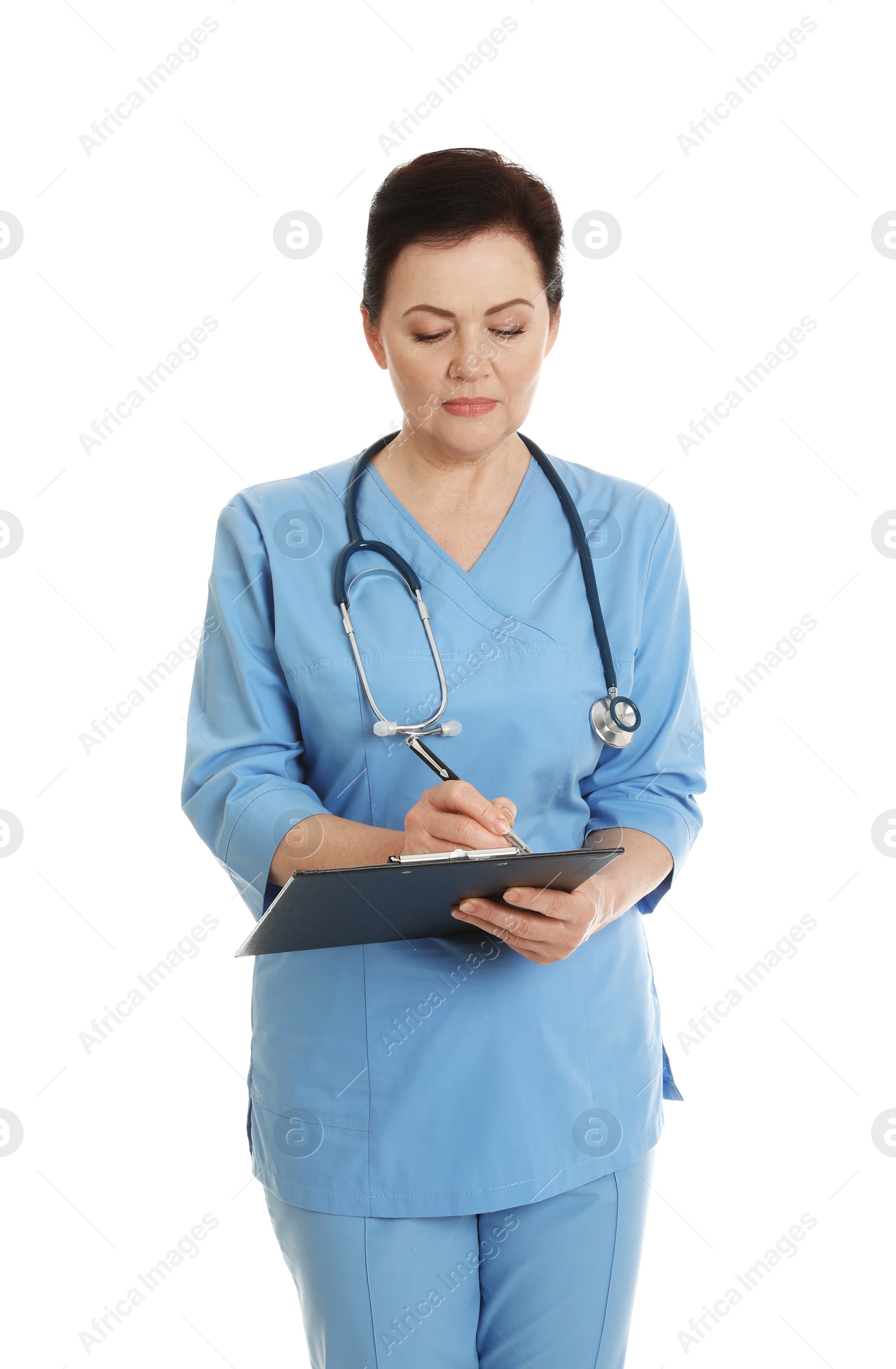 Photo of Portrait of female doctor in scrubs with clipboard isolated on white. Medical staff