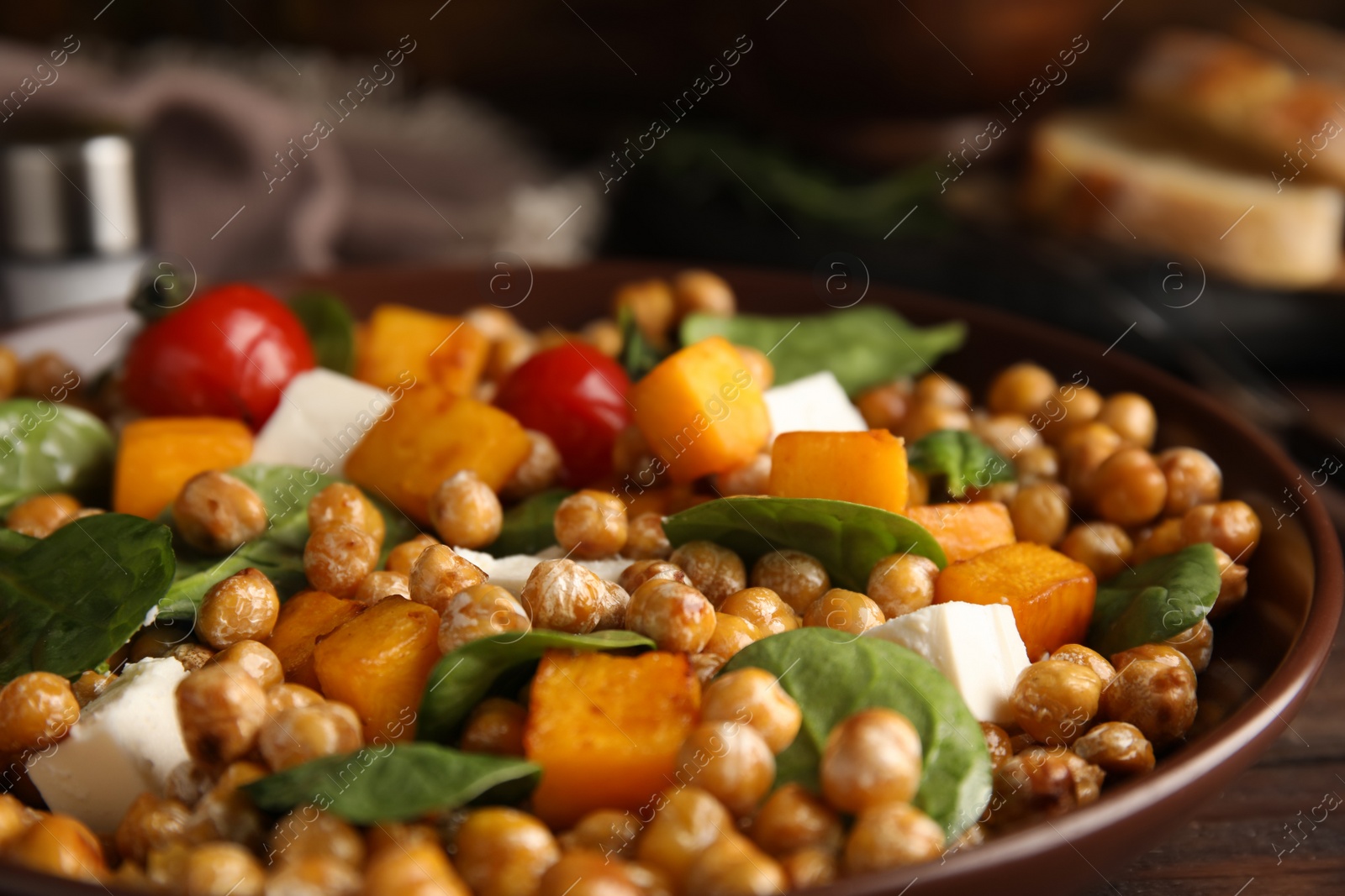 Photo of Delicious fresh chickpea salad on table, closeup
