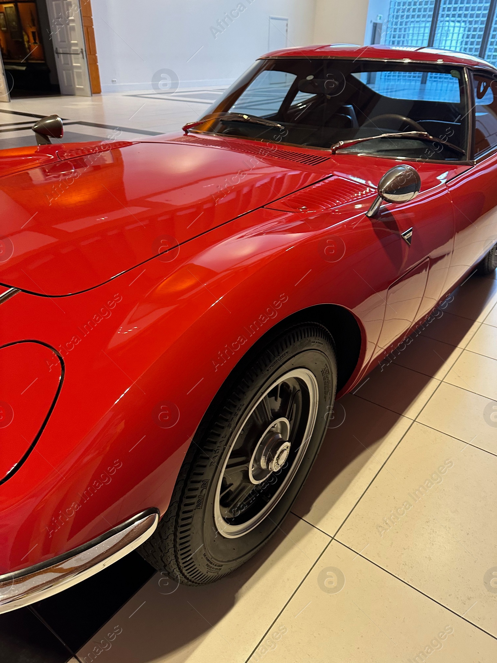 Photo of Hague, Netherlands - November 8, 2022: Beautiful view of red retro car in Louwman museum