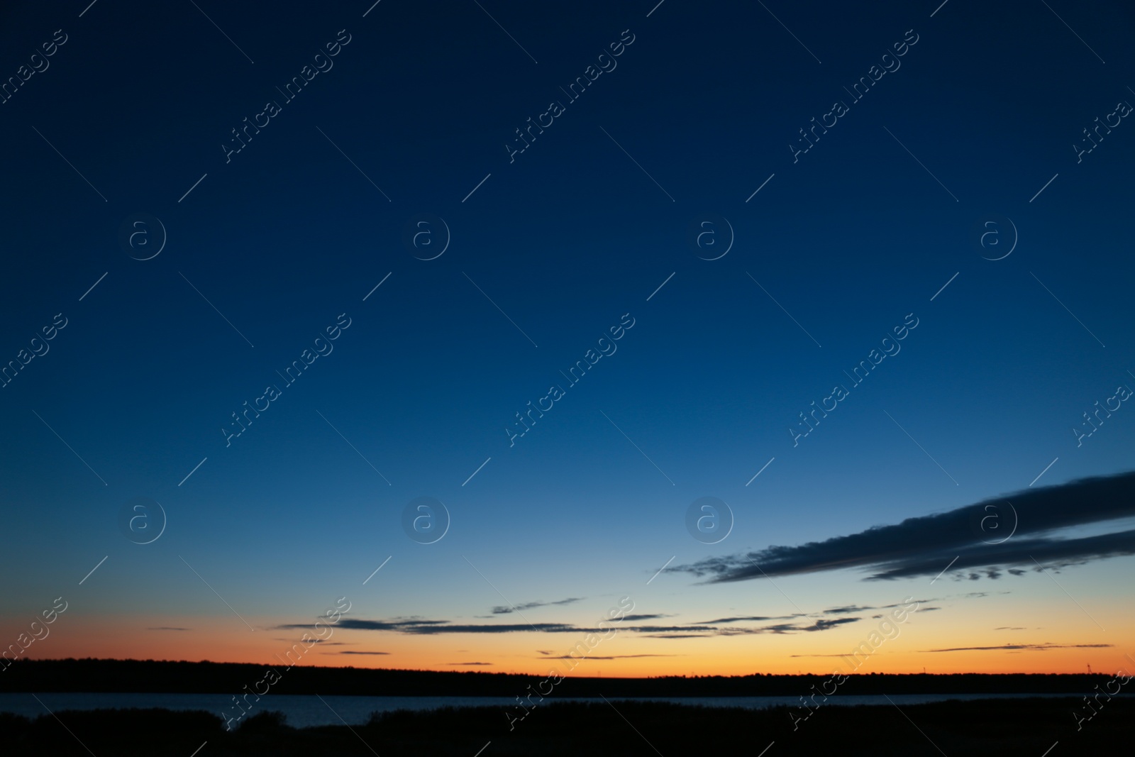 Photo of Picturesque view of beautiful sunrise on riverside. Morning sky