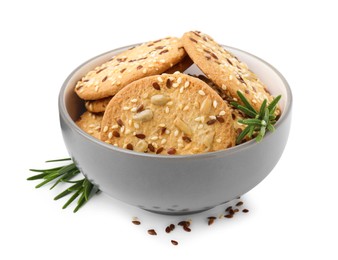 Photo of Round cereal crackers with flax, sunflower, sesame seeds and rosemary in bowl isolated on white