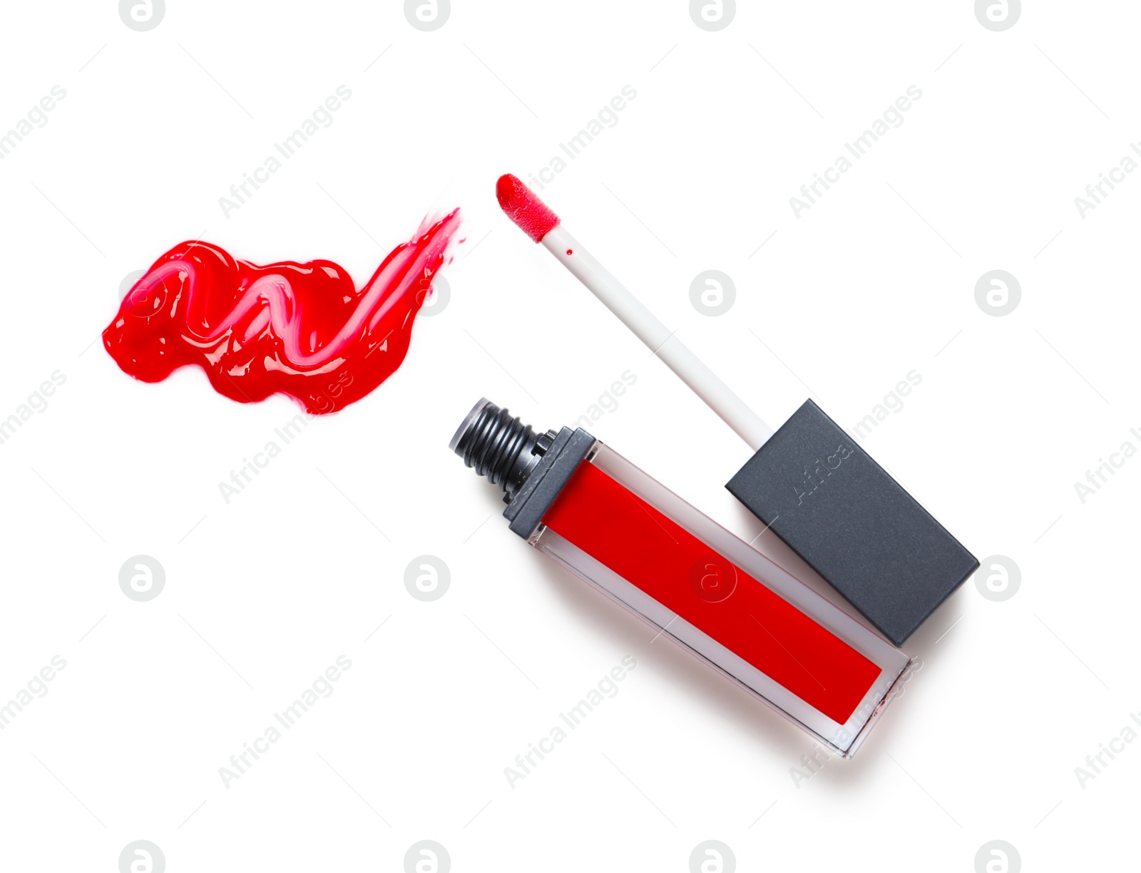 Photo of Red liquid lipstick with smear and applicator isolated on white, top view