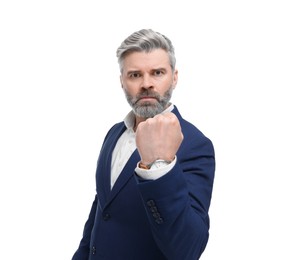 Mature businessman in stylish clothes posing on white background, low angle view