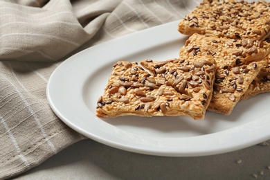 Plate with grain cereal cookies on table, closeup. Healthy snack