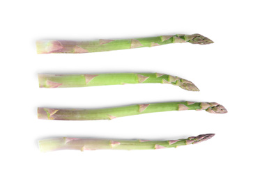 Photo of Fresh raw asparagus isolated on white, top view