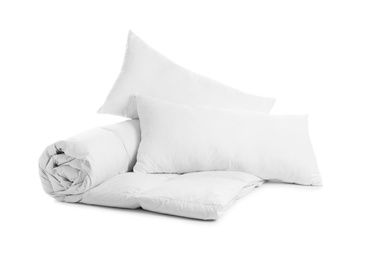 Photo of Soft blanket and pillows on white background