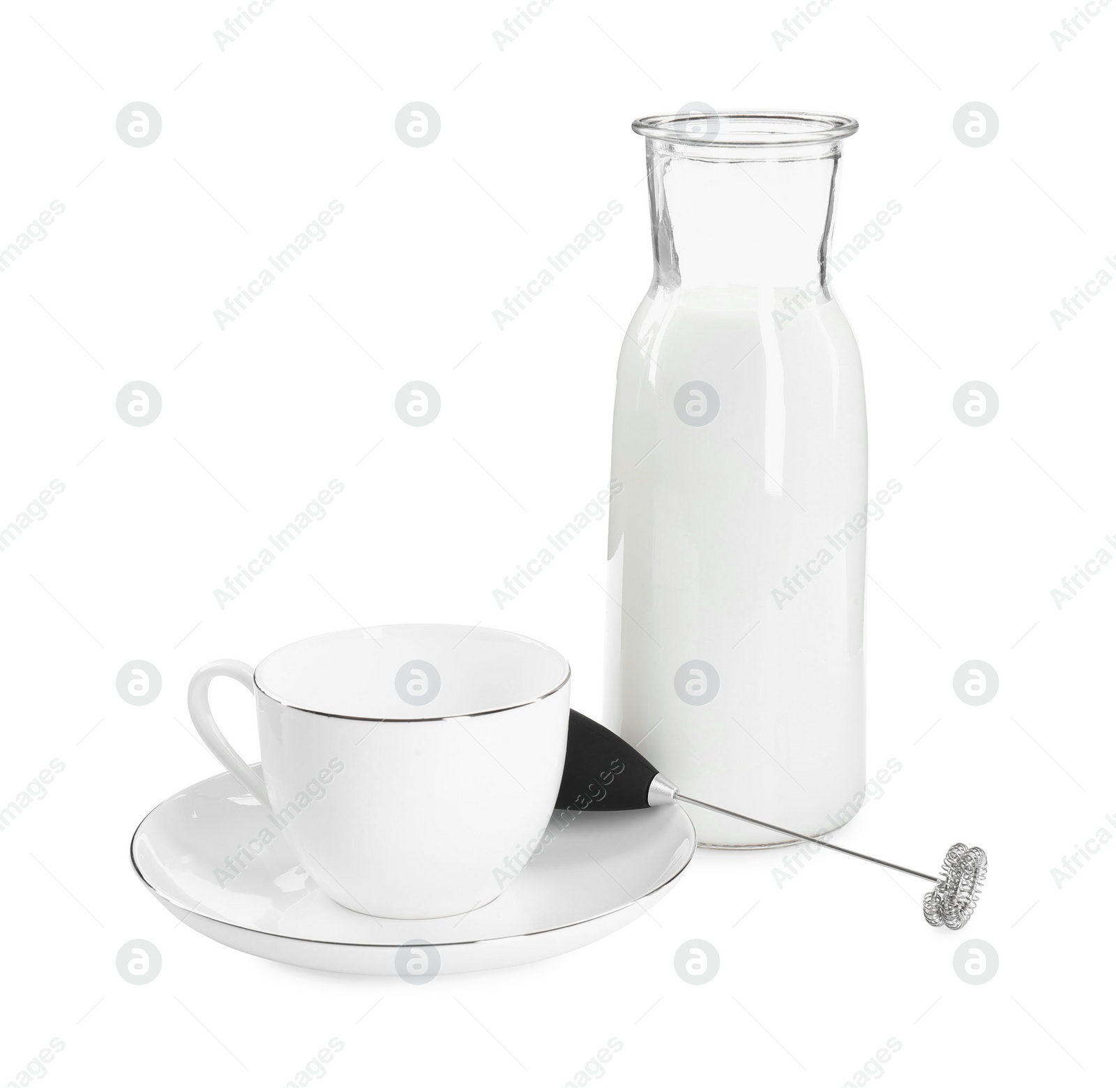 Photo of Milk frother wand, cup and glass carafe isolated on white