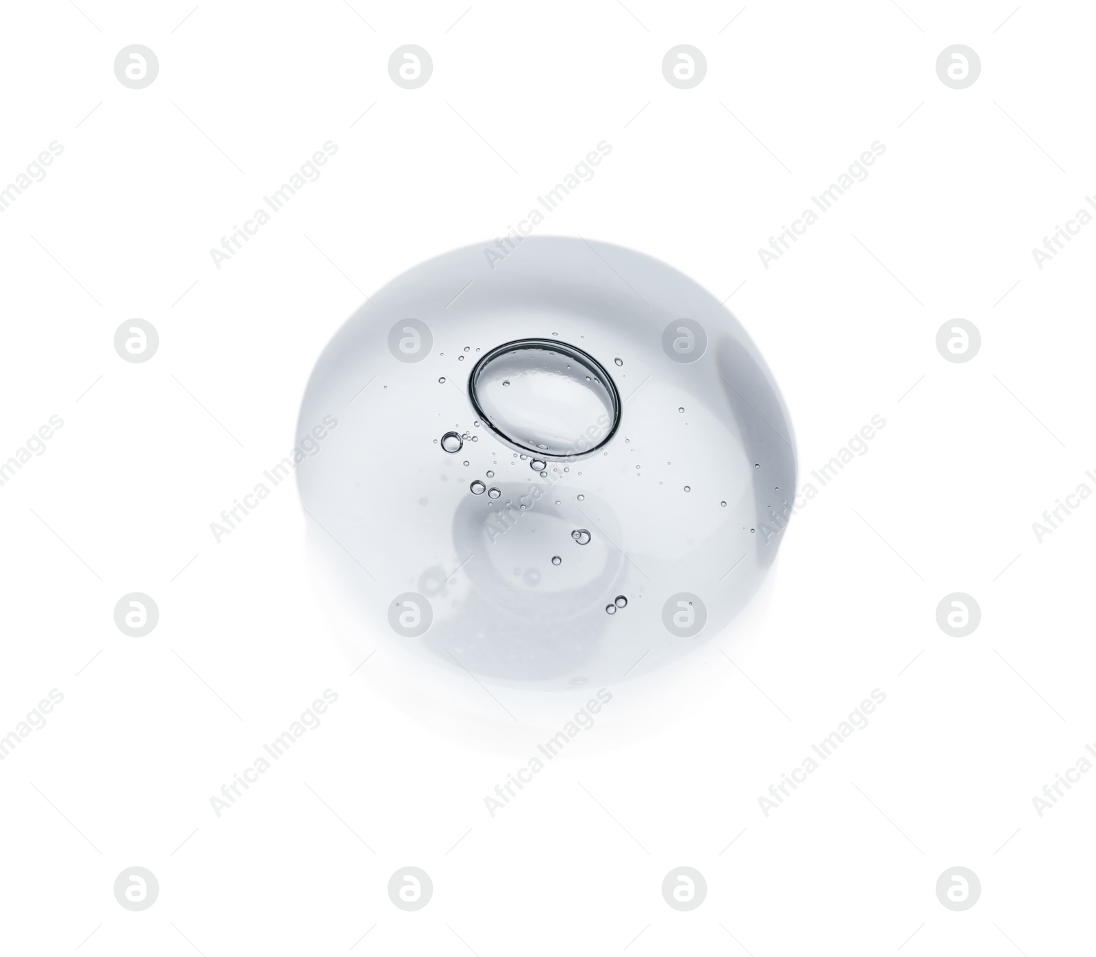 Photo of Drop of cosmetic oil on light surface, above view