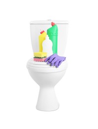 Different cleaning supplies on toilet bowl against white background