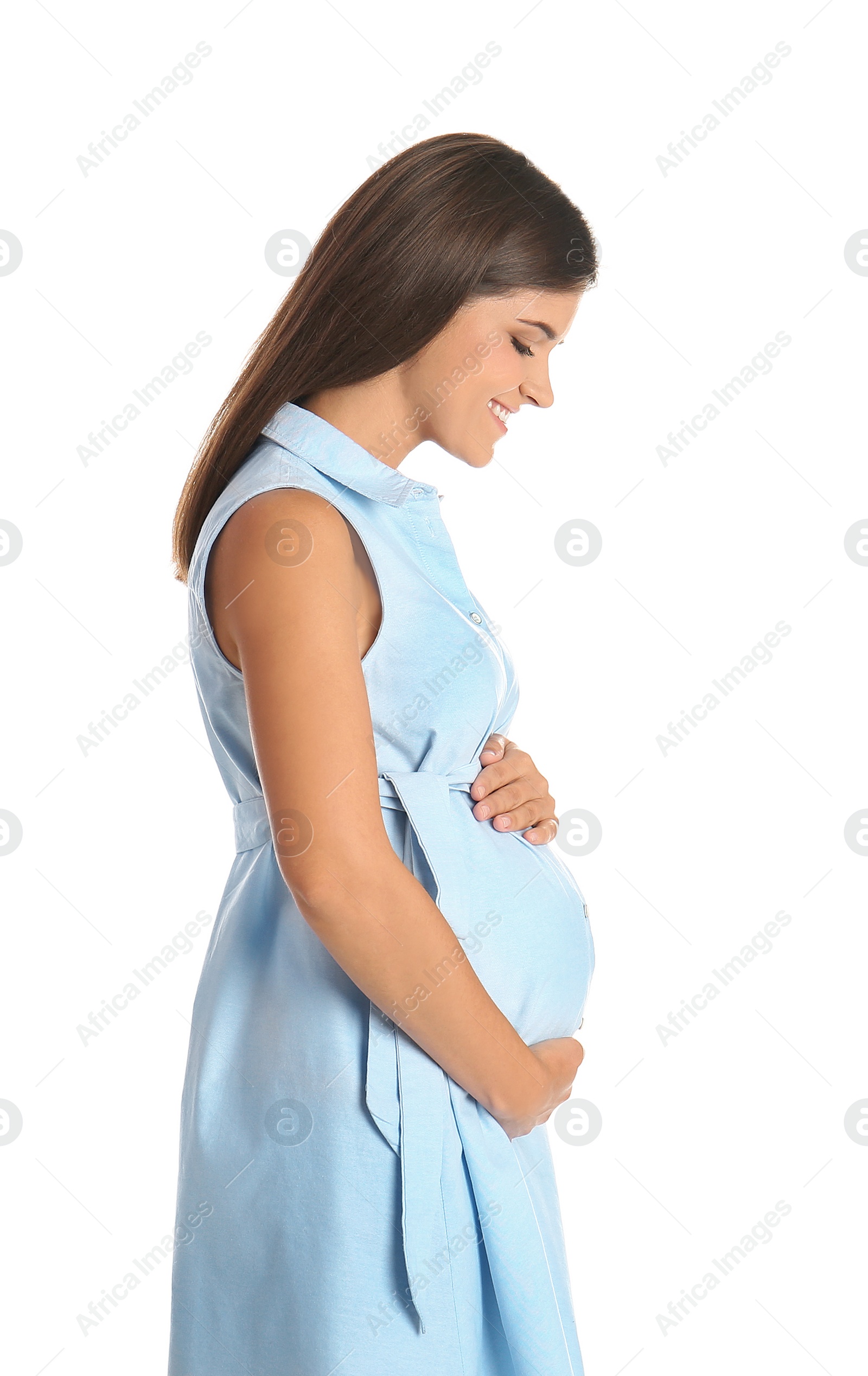 Photo of Happy pregnant woman touching her belly on white background