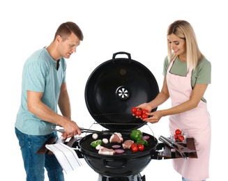 Happy couple cooking on barbecue grill, white background