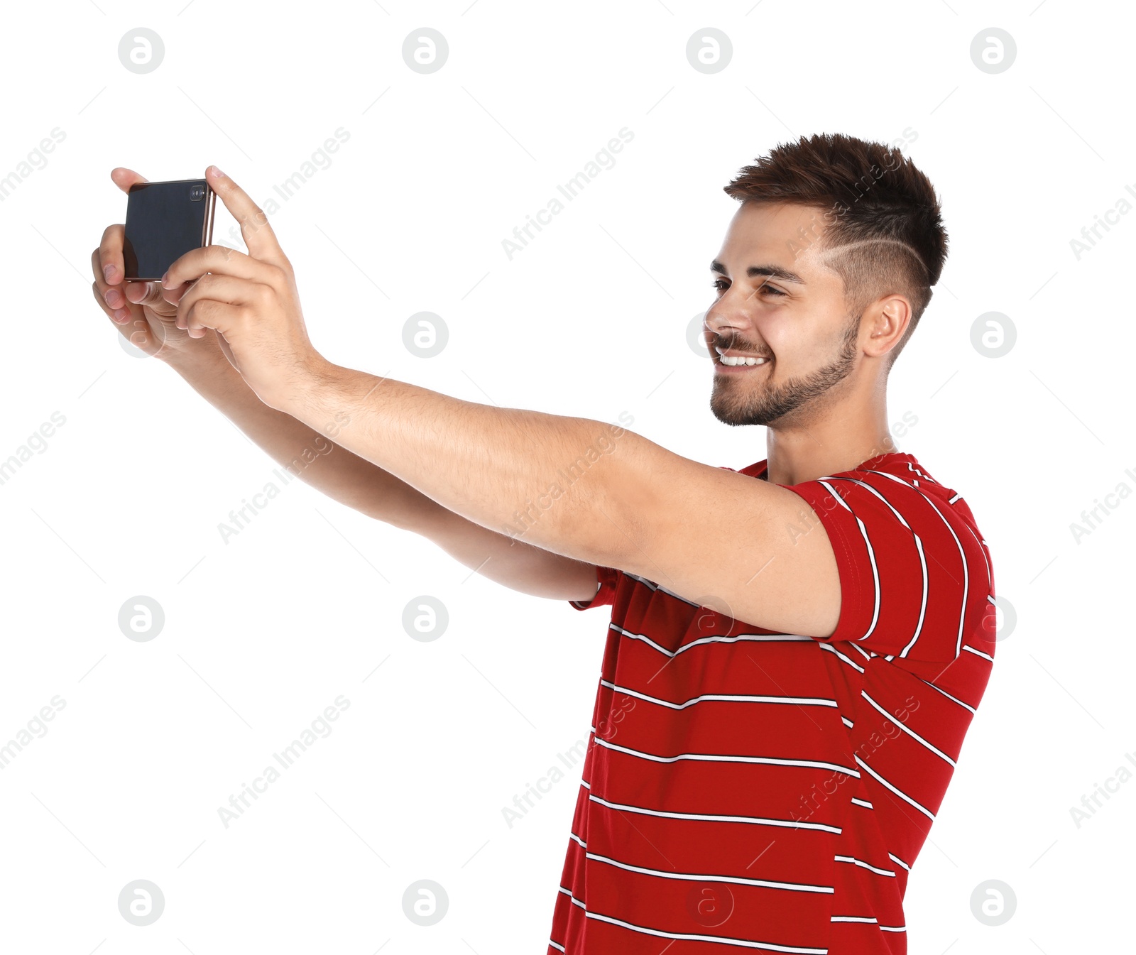 Photo of Happy young man taking selfie on white background