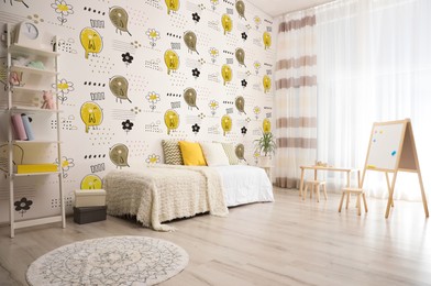 Image of Stylish room interior for child with comfortable bed near window and cute wallpapers