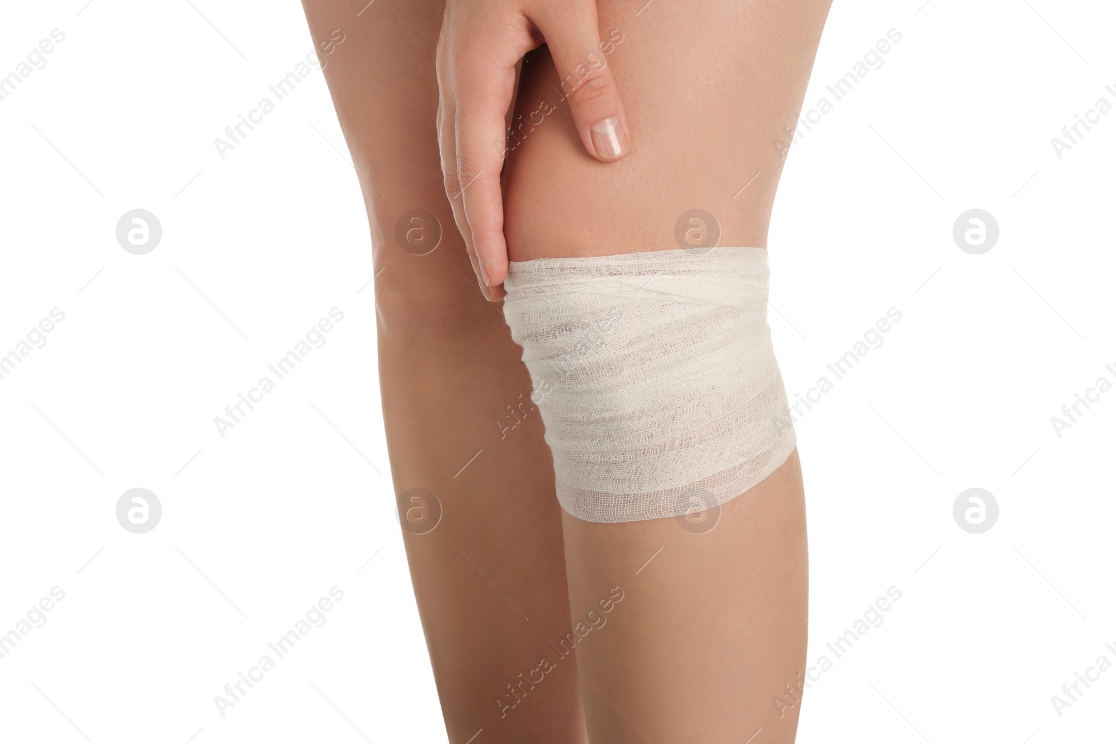 Photo of Woman with knee wrapped in medical bandage on white background, closeup