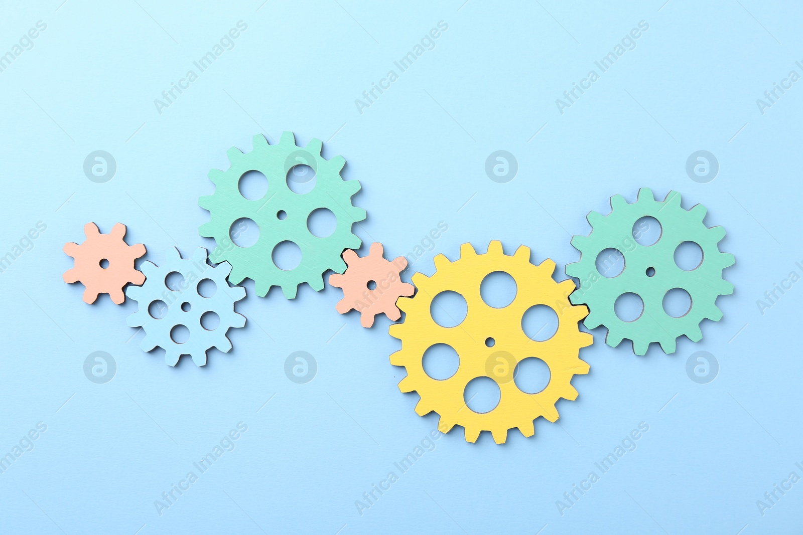 Photo of Business process organization and optimization. Scheme with colorful figures on light blue background, top view