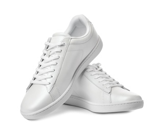 Photo of Pair of trendy sneakers on white background