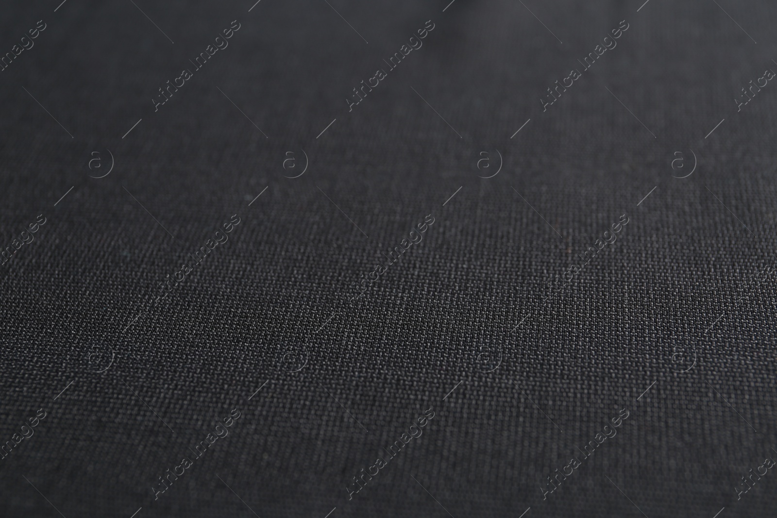 Photo of Texture of dark fabric as background, closeup