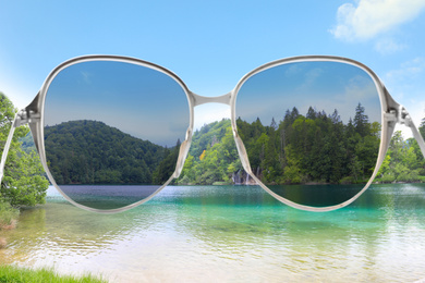 Image of River and mountains on sunny day, view through sunglasses