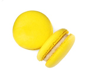 Photo of Delicious yellow macarons on white background, top view