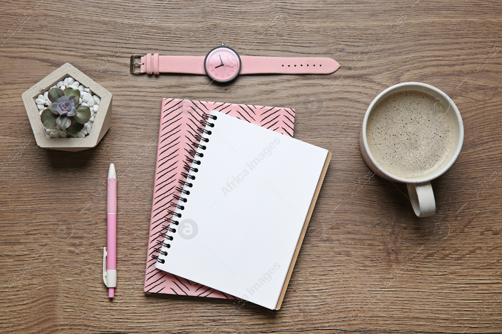 Photo of Flat lay composition with office stationery and cup of coffee on wooden table. Space for design