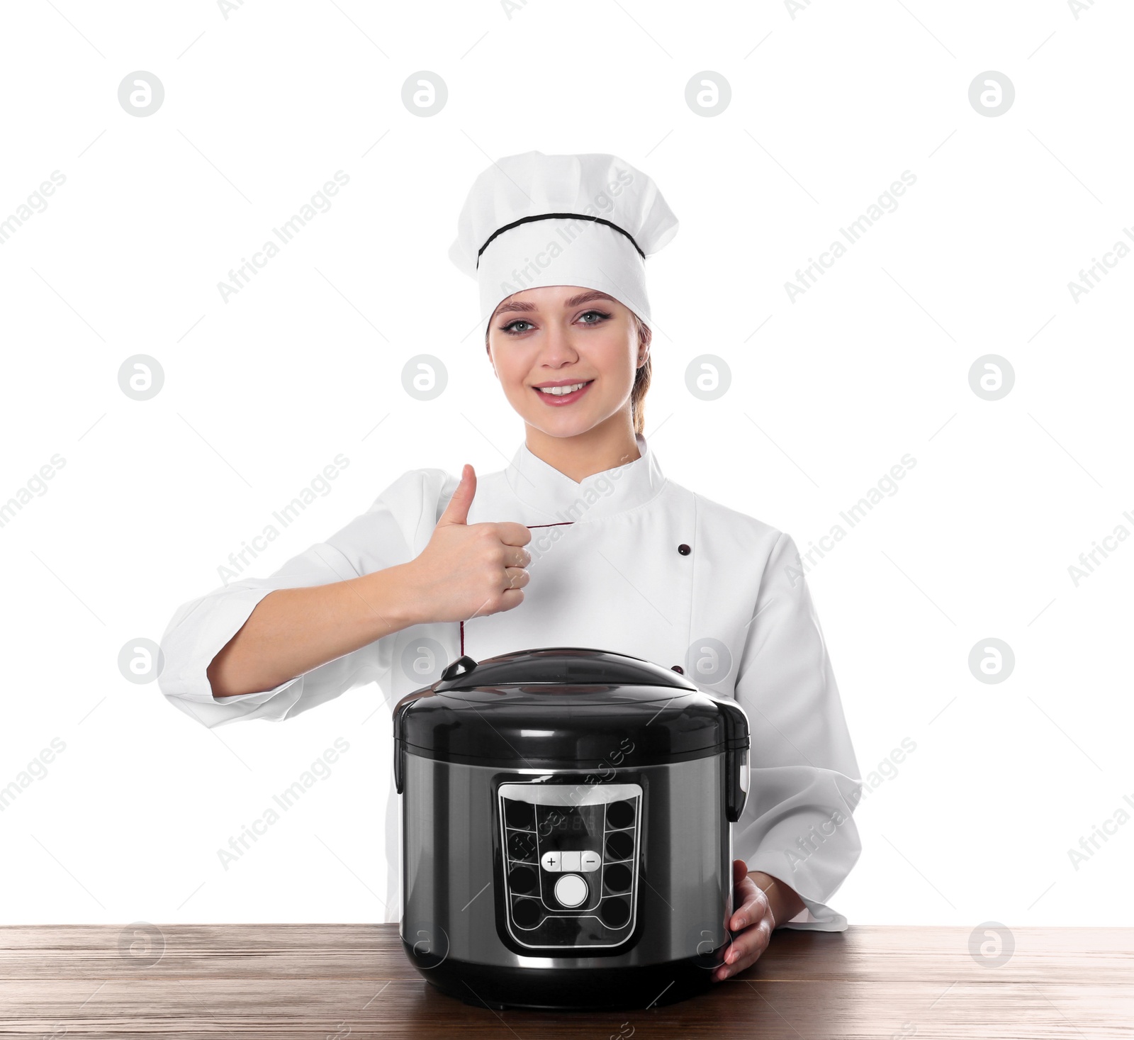 Photo of Female chef with modern multi cooker at table against white background