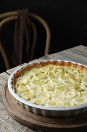 Freshly baked leek pie on old wooden table