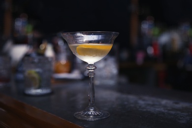 Photo of Glass of tasty cocktail on bar counter