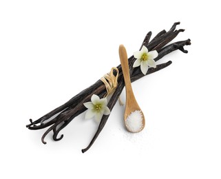 Photo of Vanilla pods, spoon with sugar and flowers isolated on white, top view