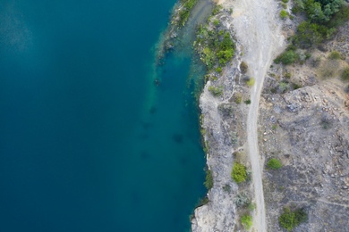 Beautiful blue lake with granite bank, top view