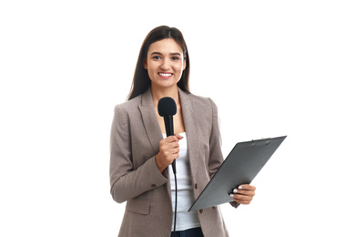 Photo of Young female journalist with microphone and clipboard on white background