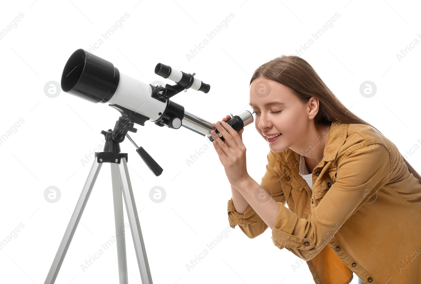 Photo of Young astronomer looking at stars through telescope on white background