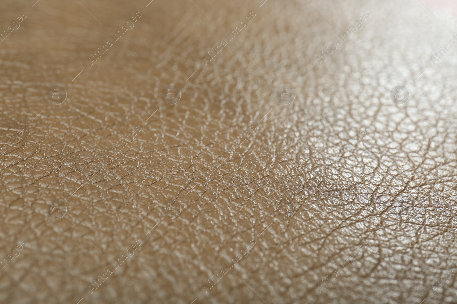 Photo of Texture of beige leather as background, closeup